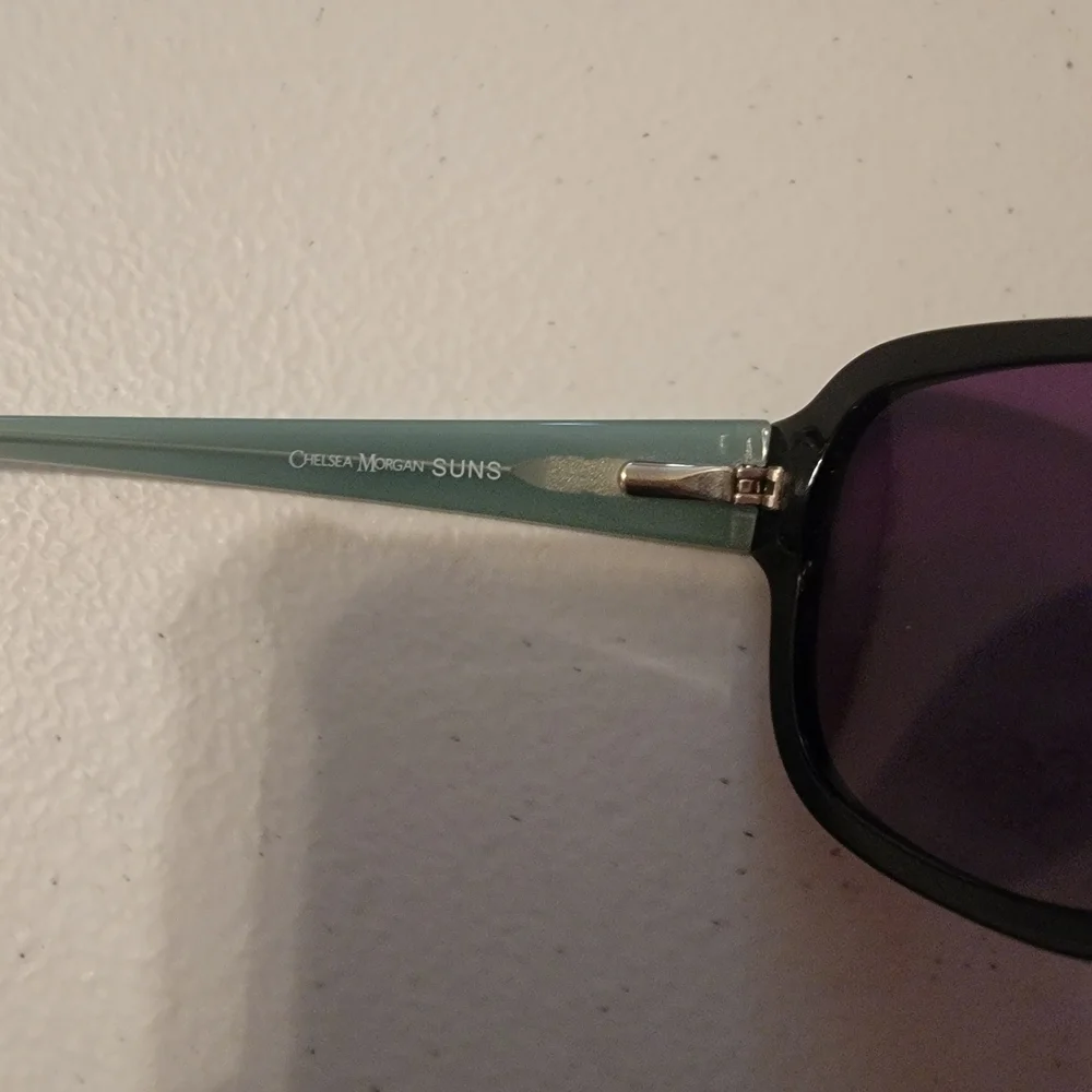 Chelsea Morgan Black Sunglasses with Purple Lenses.